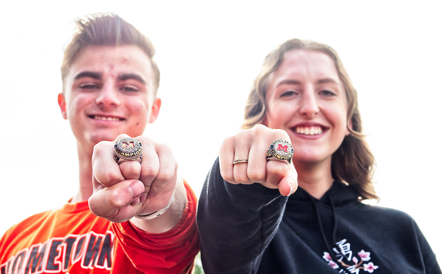 Mineola High School drum majors Cameron Bussell and Maddie Tucker show off the state marching band championship rings that were handed out to the students on Friday.  [see more rings]